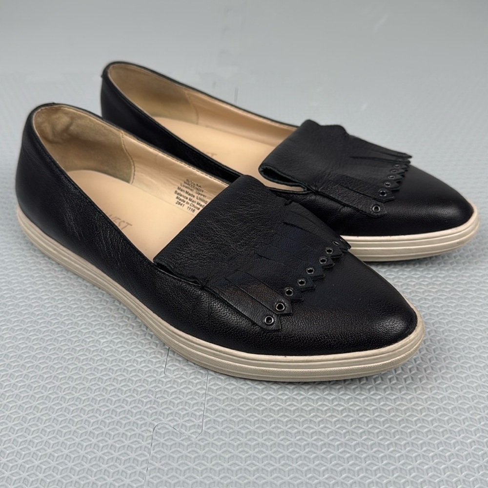 Nine West black leather flats in size 5.5M.